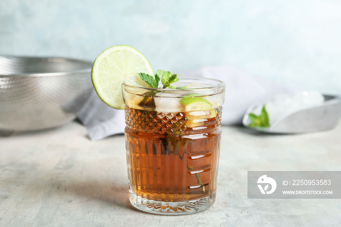 Glass of tasty Cuba Libre cocktail on table