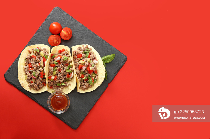 Slate plate with tasty fresh tacos on color background