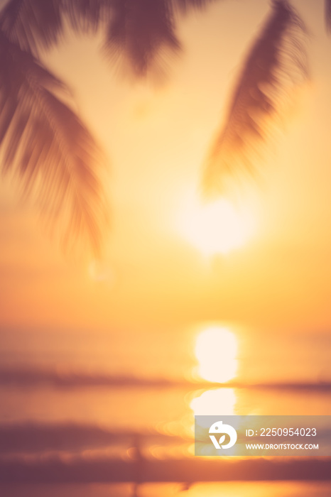 Blur beautiful nature green palm leaf on tropical beach with bokeh sun light wave abstract backgroun