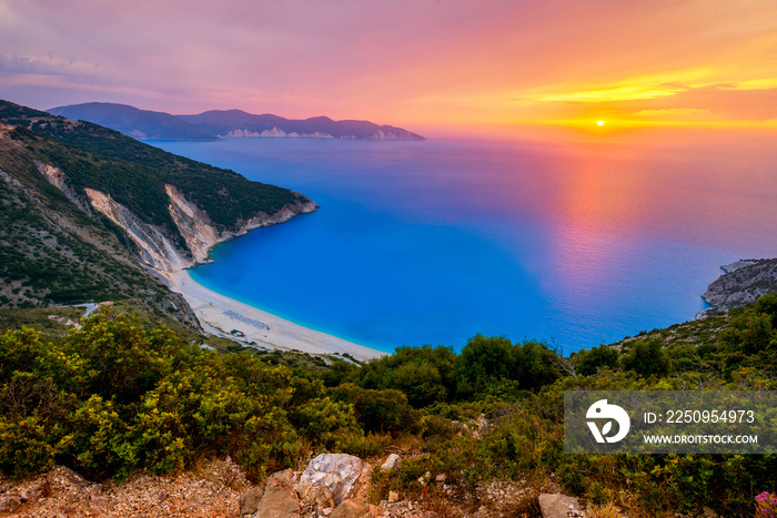 Beautiful summer sunset on Mirtos beach in Greece