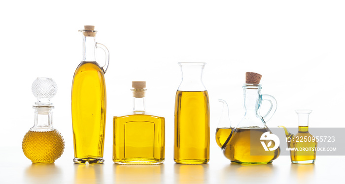 Set of bottles with olive oil on white background