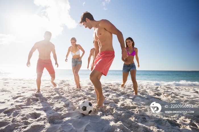 Friends playing football