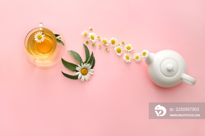 Tasty chamomile tea on color background