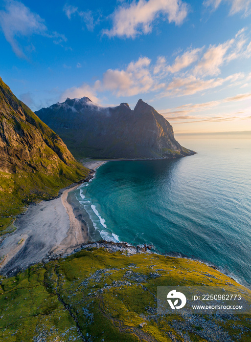 Aerial view of Lofoten islands, Northern Norway, Kvalvika beach, during sunset.