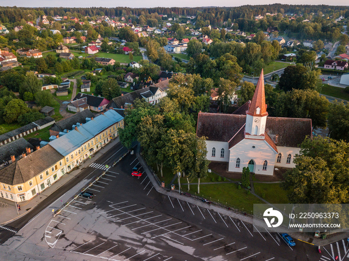 Aerial view of empty parking lot in city center in front of the church, Smiltene, Latvia