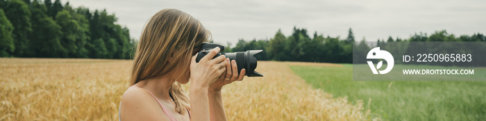 Female photographer taking photos of beautiful nature