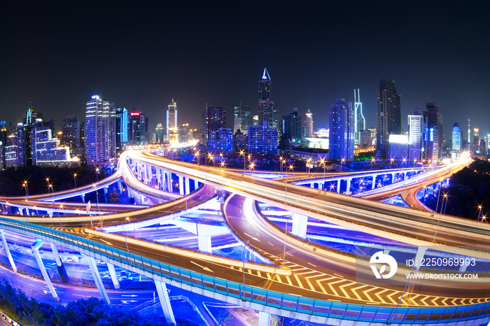 illuminated traffic on elevated expressway in modern city.