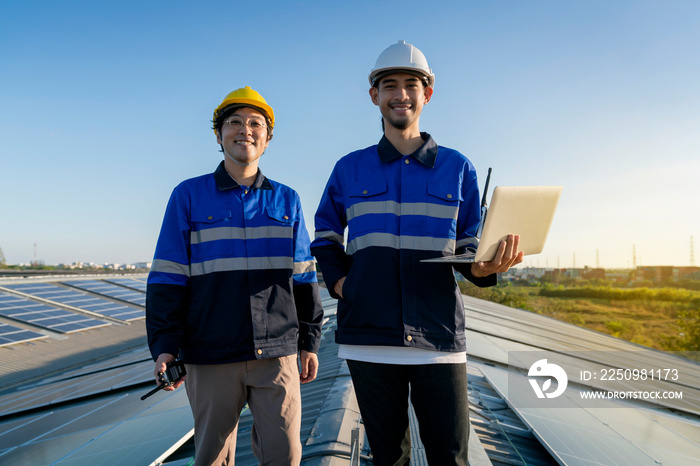 portrait smiling professional engineer with laptop and tablet maintenance checking installing solar 