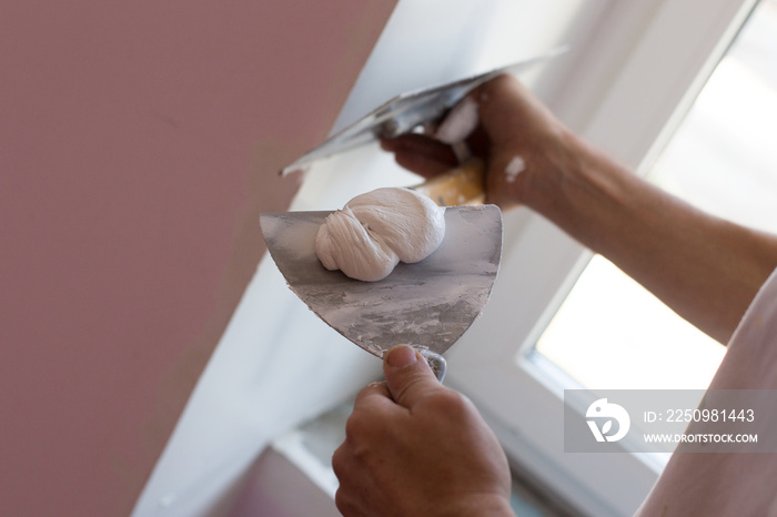 House painter skimming wall