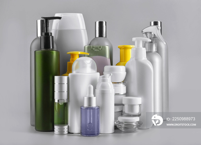 Set of body care products on grey background