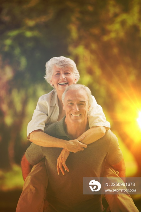 Man giving wife a piggyback