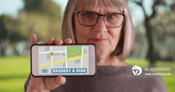 Mature white female holding up smartphone to camera with rideshare app open