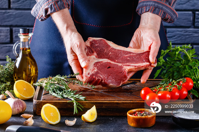 man cooking beefsteak on a kitchen, close-up