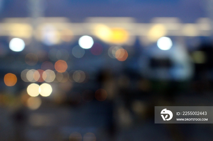 Blurry Abstract Bokeh Background: Airplane parked at departure gate at an airport.