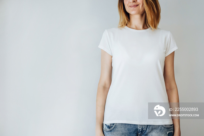 Young pretty girl wearing blank white t-shirt with space for your logo or design, mock-up of white c