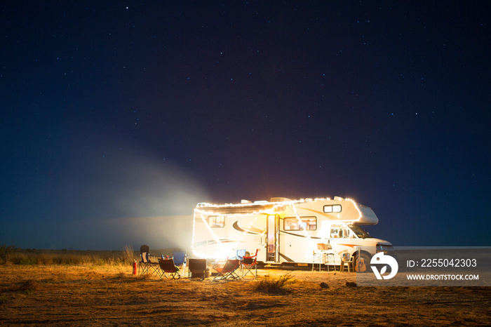 Illuminated motor home at night