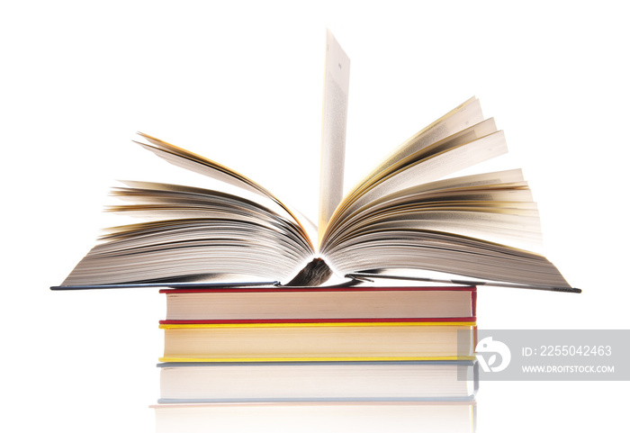 Composition with stack of books isolated on white