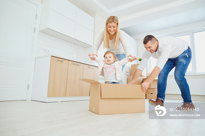 Happy family unpacking boxes at new home