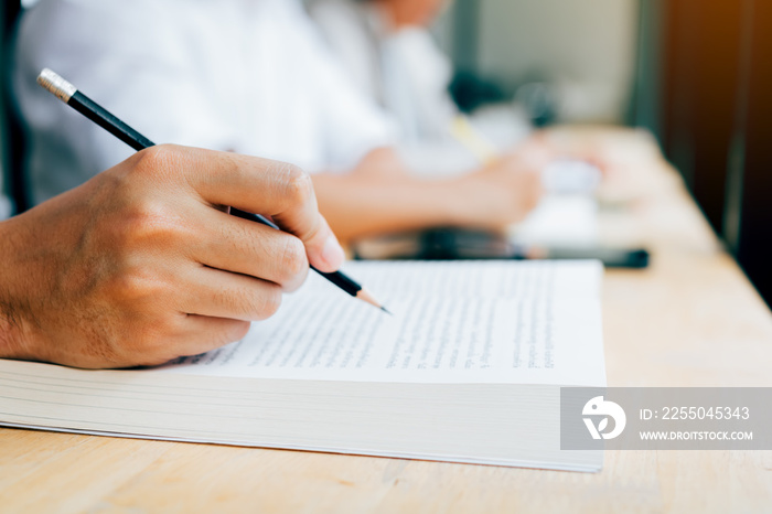 Group of students are writing a university test.