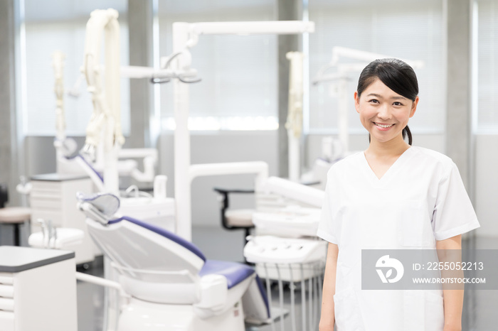 portrait of asian dentist in dental clinic