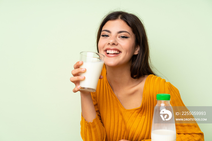 Happy Teenager girl having breakfast milk