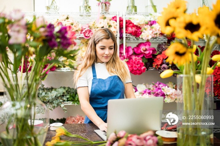 Flower shop owner using a computer