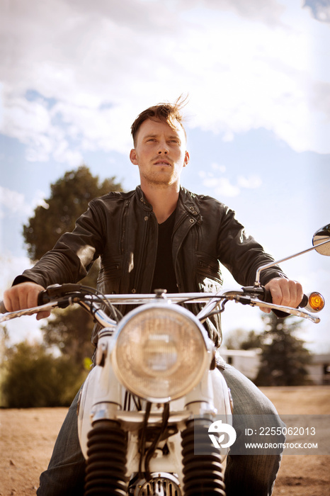 Young man riding motorcycle