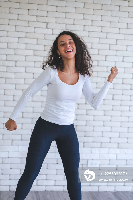 Young latin woman created her dancing video content by smartphone camera to live streaming to social