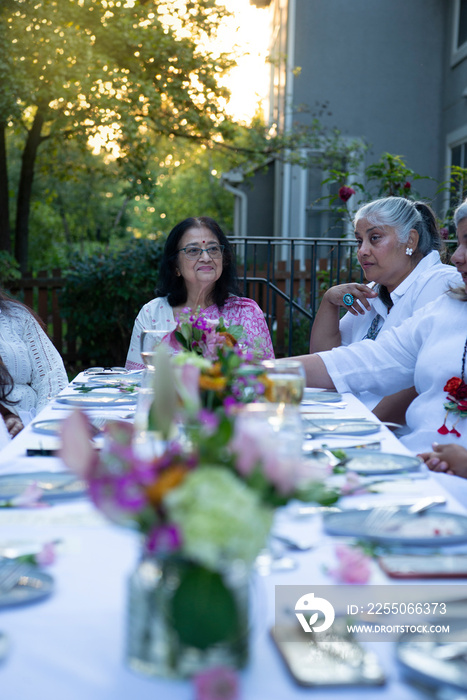 Woman enjoying a dinner party