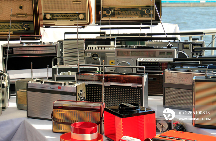 Numerous old radios on a flea market