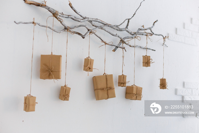 Mockup kraft gift boxes craft hang on the branches