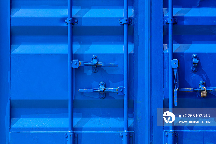 detail of blue industrial shipping container door.