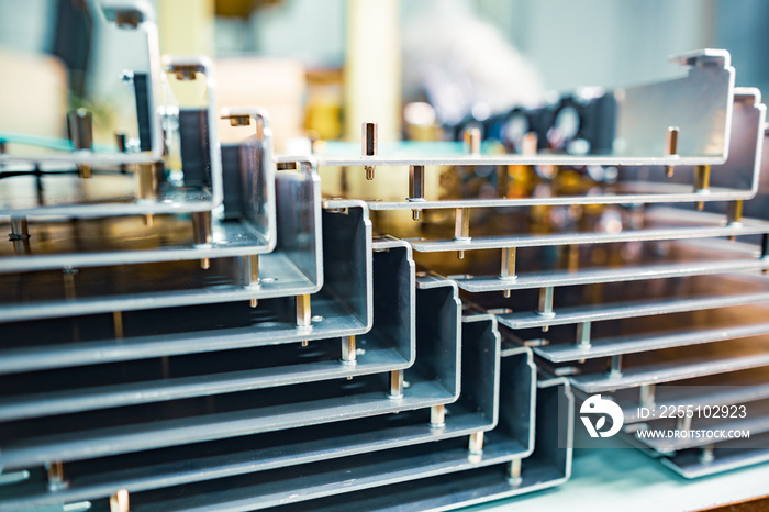 Modern metal parts of TFT displays on a table in a workshop