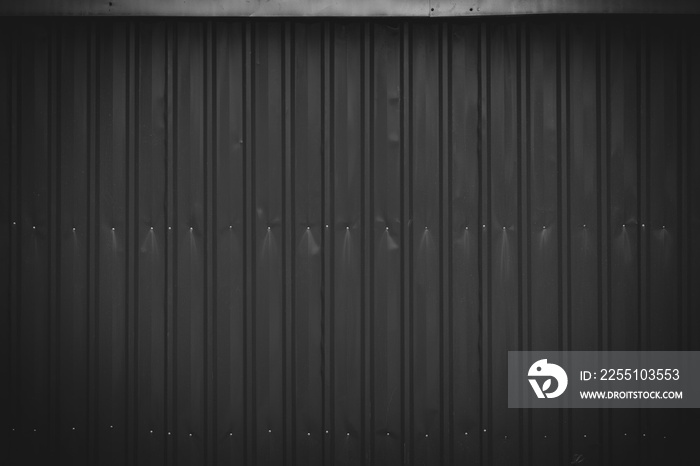 Dark corrugated metal or zinc texture surface or black galvanize steel industrial texture and background.