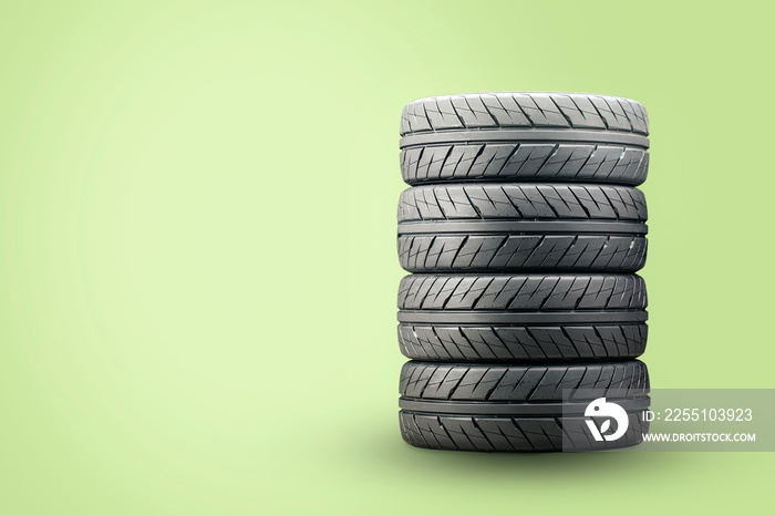 a set of new summer tires on a green background. economical modern quiet tires, empty copyspace space