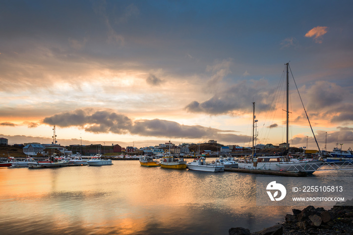 Stykkisholmur harbour at sunset. Stykkisholmur is a town situated in the western part of Iceland, in the northern part of the Saefellsnes peninsula