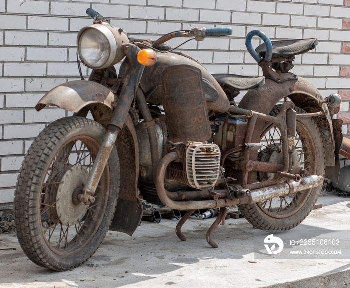 Retro moto, old antique bike covered with rust.