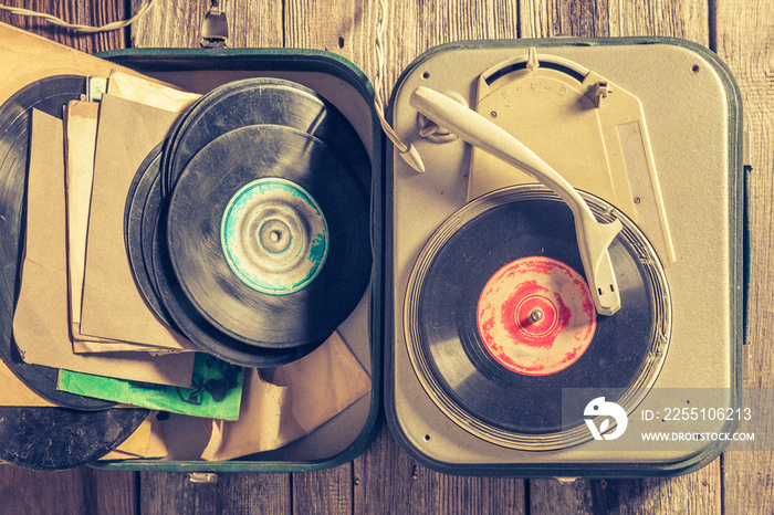 Record player and vinyls as toned and filtered photo