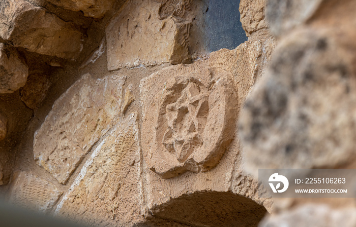 Star of David carved from stone over the entrance to the Jewish part of the tomb of the prophet Samuel on Mount Joy near Jerusalem in Israel