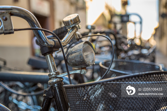 Closeup of an old vintage bicycle headlight in Italy.