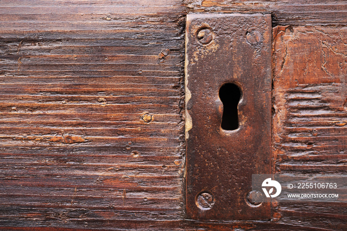 Lock keyhole on old wooden door