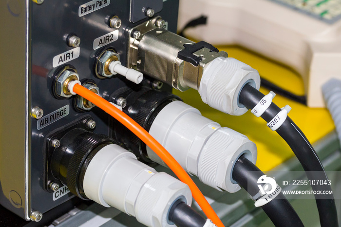 electric wire and air hose connected at control box for robot arm welding