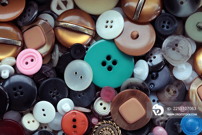 Sewing buttons of different colors