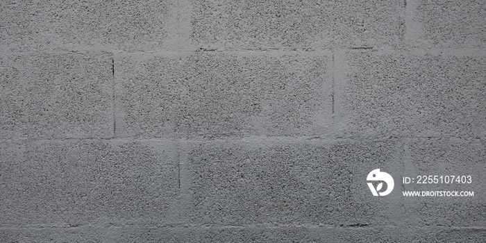 Grey cinderblock brick wall for background gray blockwork texture