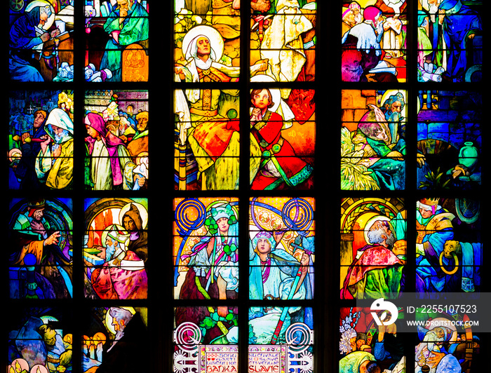 Impressive view of art nouveau stained glass window by Alfons Mucha, St. Vitus Cathedral, Prague castle, Czech Republic