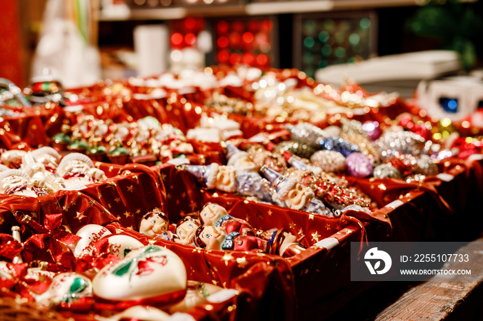 Colorful close up details of christmas fair market. Balls decorations for sales. Xmas market in Germany with traditional decorative toys.