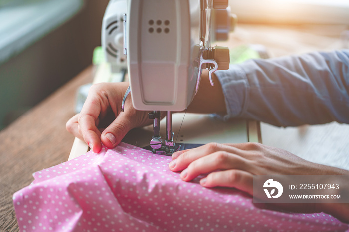 Electric sewing machine close up during sewing process