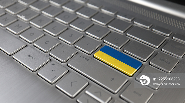 Keyboard with Ukraine flag on the enter button, represents cyber attack of Ukraine, metaphor of learning Ukrainian language