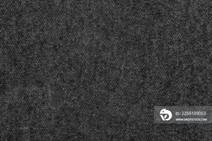 Black natural texture of knitted wool textile material background. dark gray cotton fabric woven canvas texture