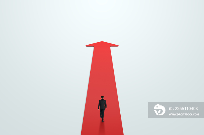 Road to success, achievement and personal development concept with walking on red carpet in form of arrow growing up businessman back view on light background